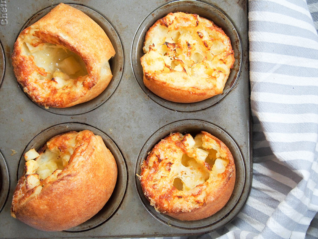 These apple and cheddar cheese Yorkshire pudding make for an incredibly easy and tasty breakfast, snack or side. apple and cheddar cheese Yorkshire pudding in pan from above