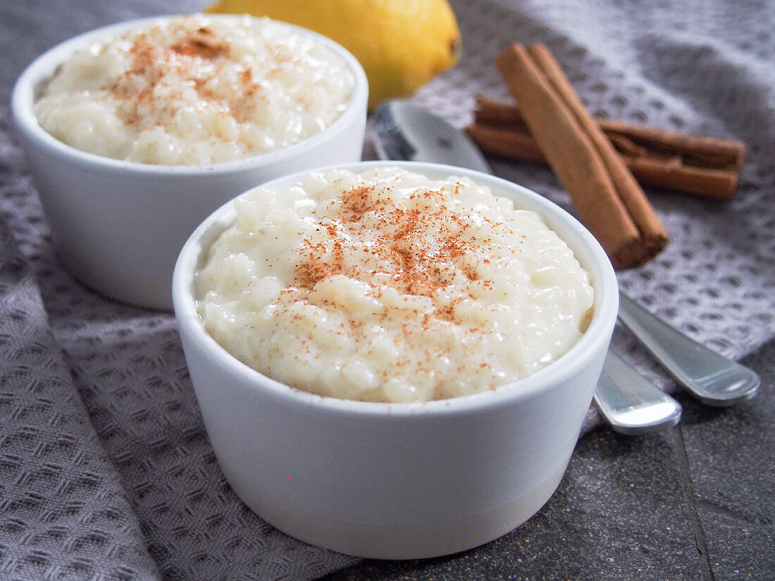 Arroz con leche (Spanish rice pudding) is made with only a few ingredients and is wonderfully creamy and comforting Arroz con leche (Spanish rice pudding) in two small bowls