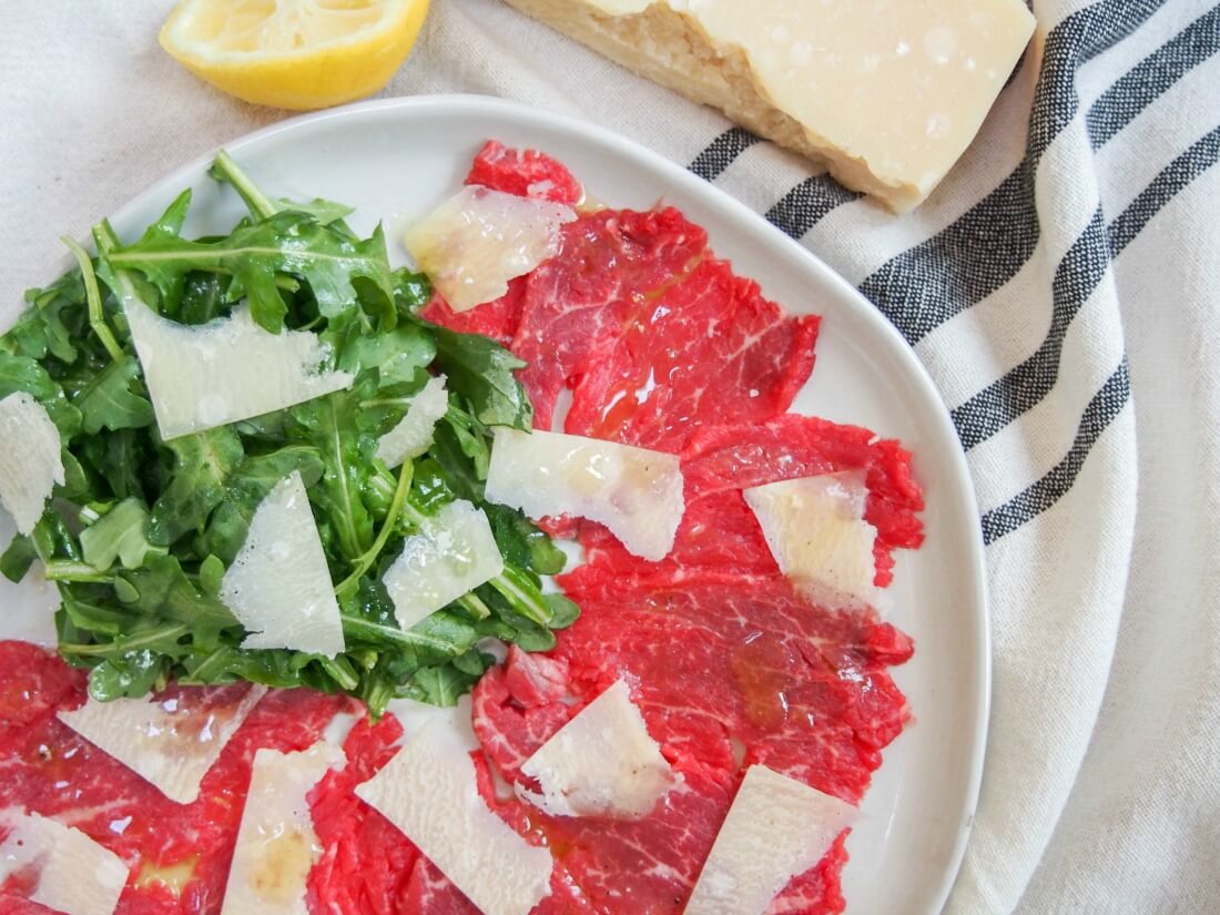 beef carpaccio makes an easy, delicious and impressive appetizer part view of plate of beef carpaccio with truffle vinaigrette