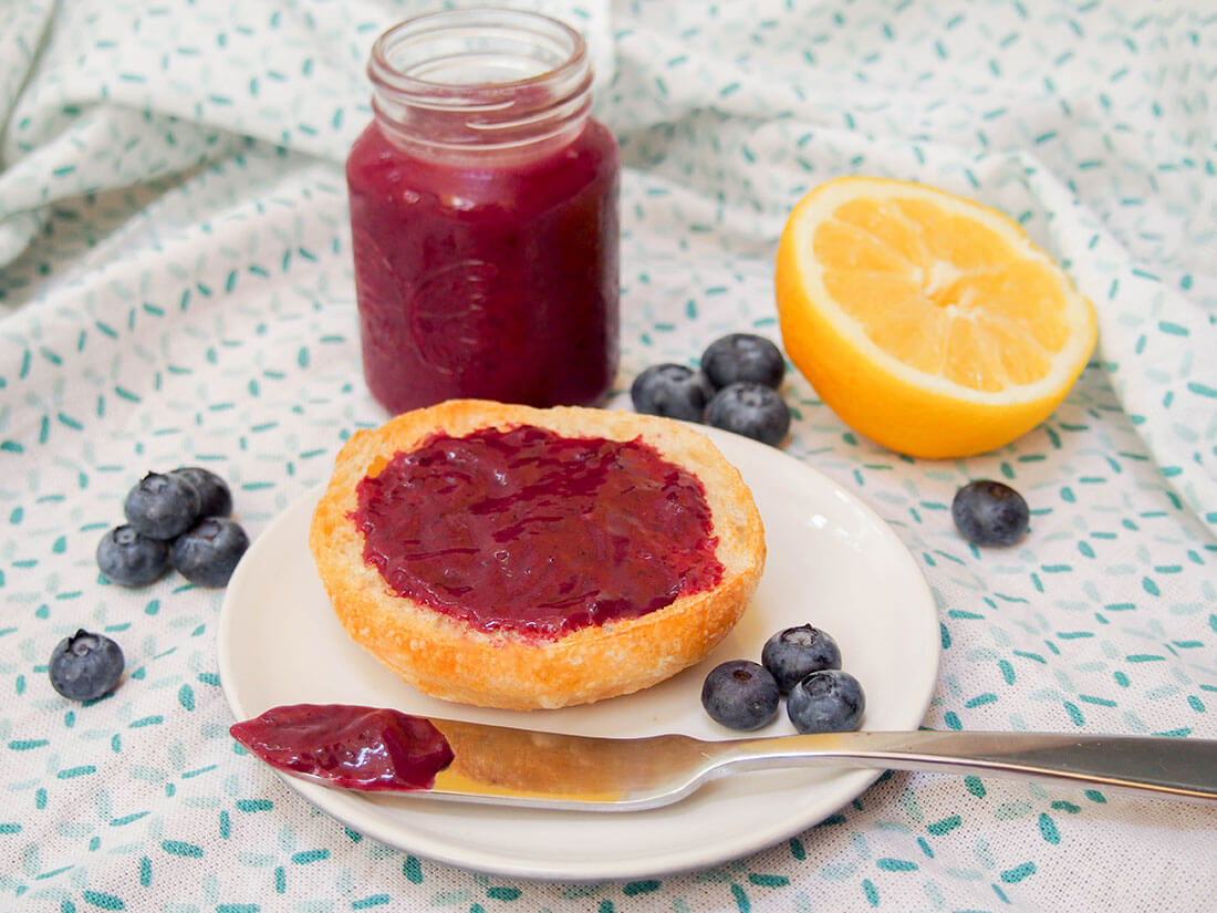 Blueberry curd is a beautifully bright variation on lemon curd that's a wonderful way to brighten up your toast. It's easy to make, and with a gentle blueberry and citrus flavor, it's a great change from jam. Blueberry curd in jar and on piece of bread with some on knife in front