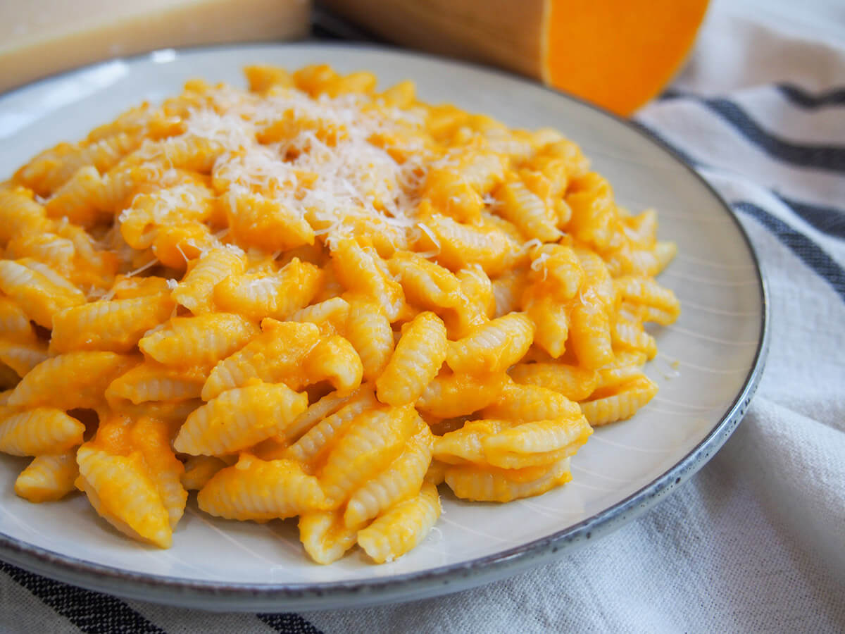 This 4-ingredient butternut squash sauce is quick and easy to make. Perfectly paired with gnocchi, it also works well with pasta. Tasty and comforting. plate of pasta coated with butternut squash pasta sauce