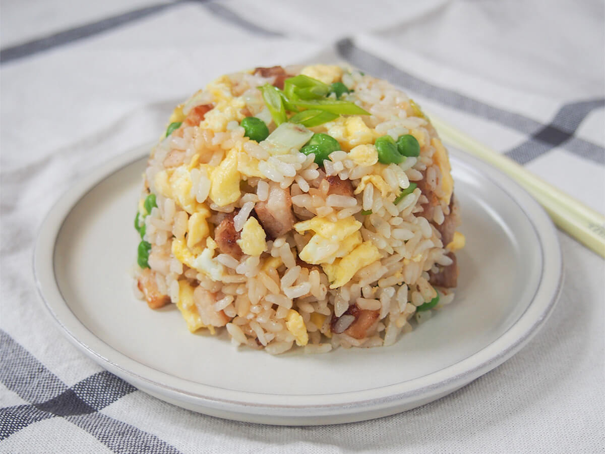 Chashu chahan (Japanese fried rice with pork belly) plate with mound of chashu chahan, Japanese fried rice.