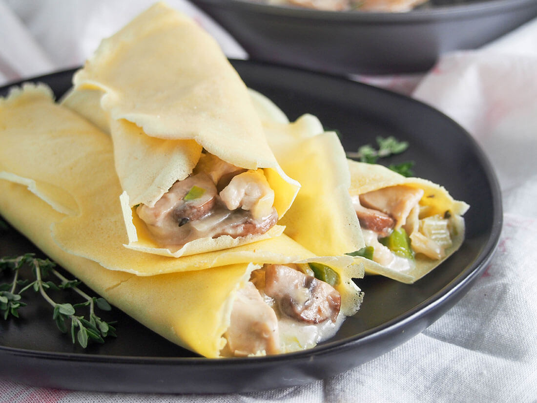 These turkey or chicken crepes with leek and mushrooms are a great way to use leftover meat in a tasty comforting dish. Chicken crepes with leek and mushroom on plate