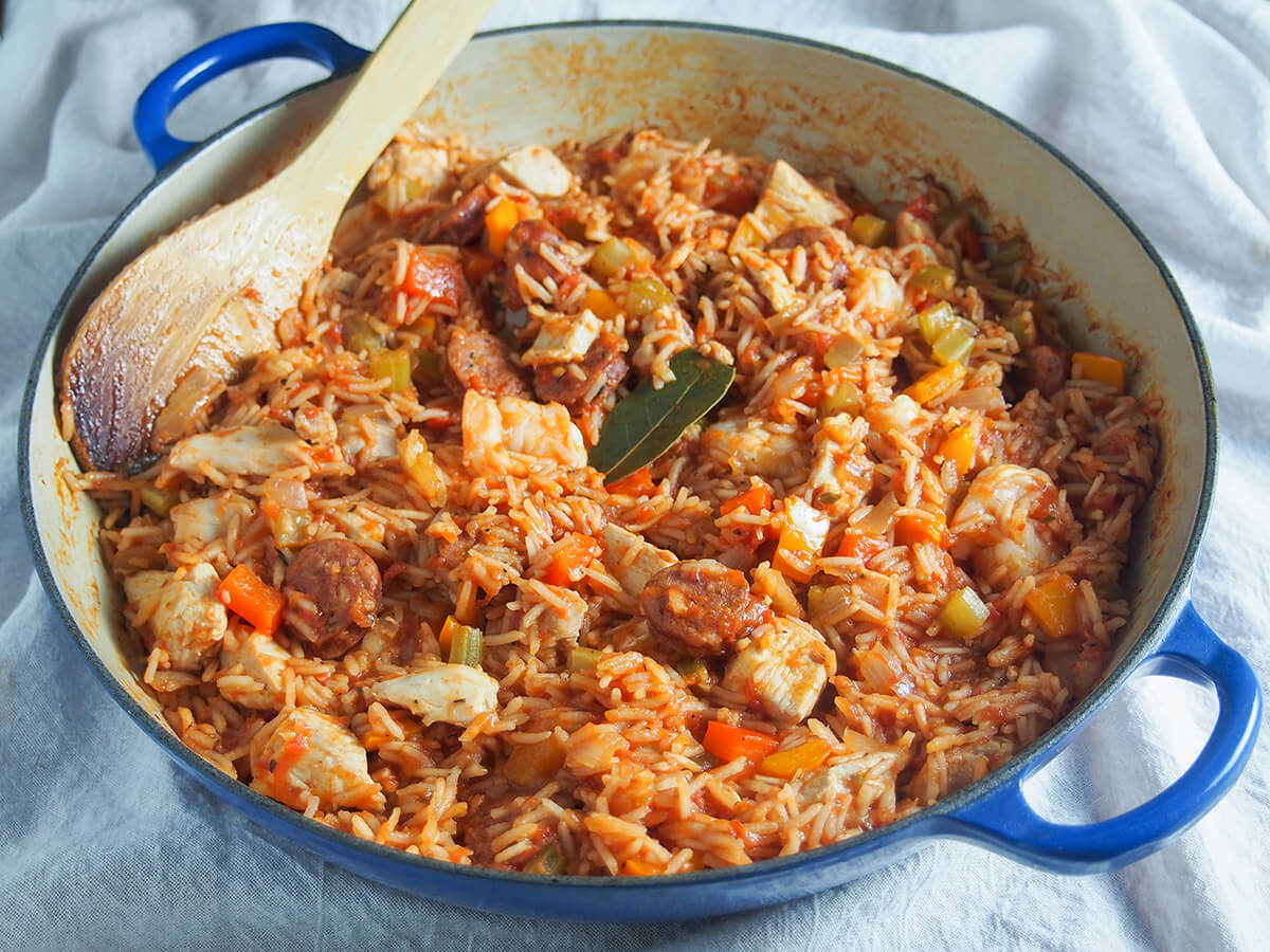 Jambalaya is a classic Louisiana rice dish, packed with lots of wonderful flavors. With chicken, shrimp, andouille sausage and plenty colorful veg, this Creole jambalaya is a flavorful, comforting meal. dish of Creole jambalaya with spoon to back of dish