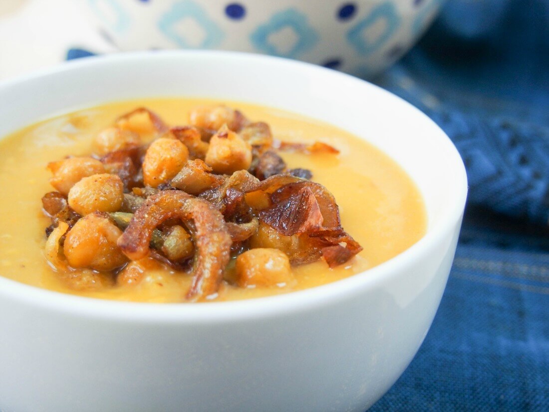 Delicata squash soup with curried chickpeas and onions Delicata squash soup with curried chickpeas and onions - close view of bowl from side