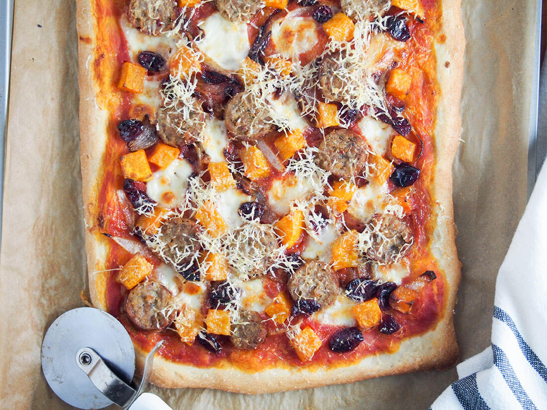 fall pizza with sausage and squash - a delicious combination of flavors fall pizza with sausage and squash with pizza cutter to side