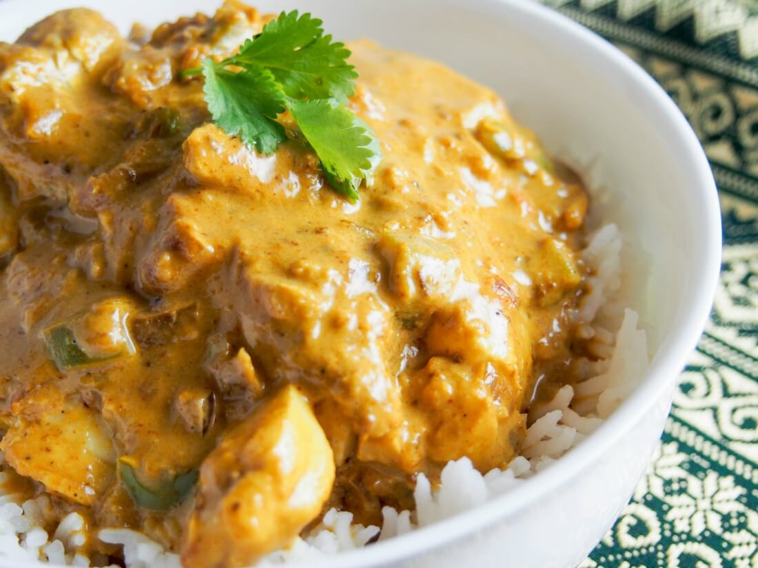This Goan fish curry is really easy to make, packed with flavor & spice, and ready in less than 30 minutes. A delicious dish that's way better than take out. close up view of Goan fish curry in bowl