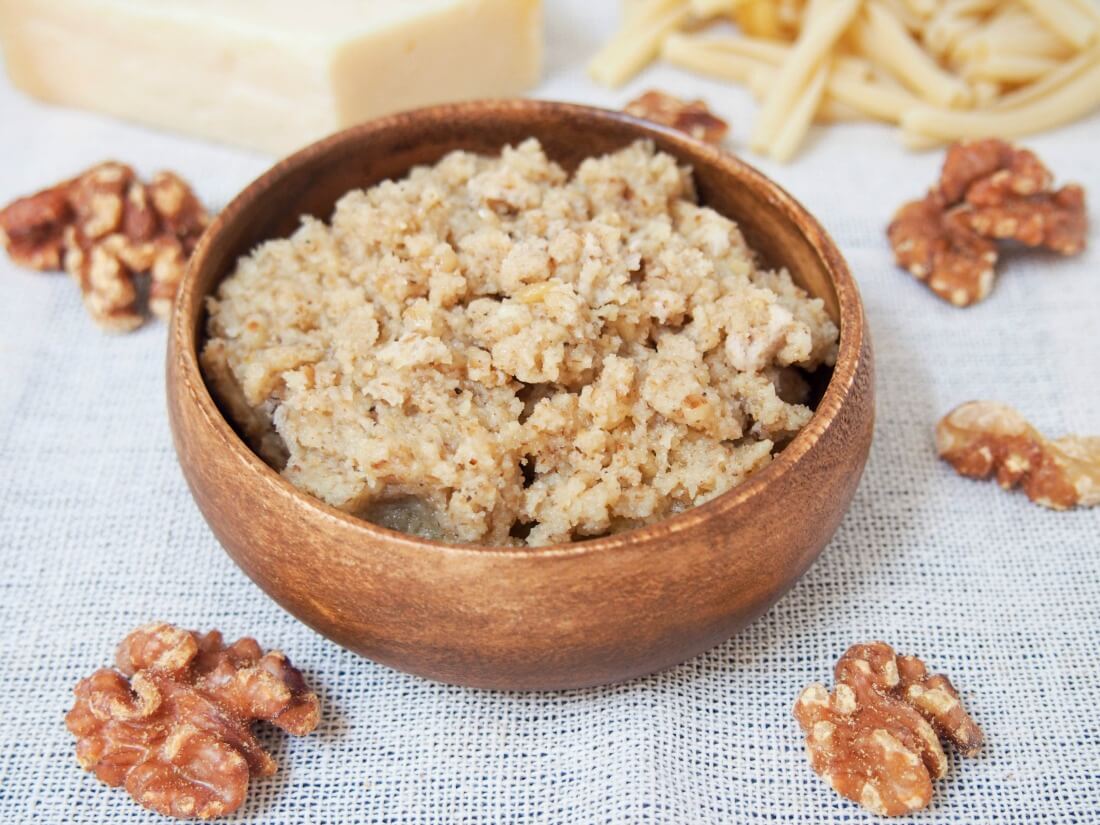 Walnut sauce is a lesser-known Italian sauce for pasta that's easy to make and surprisingly creamy and flavorful given the humble ingredients. A great way to change up pasta night! Italian walnut sauce for pasta in small bowl