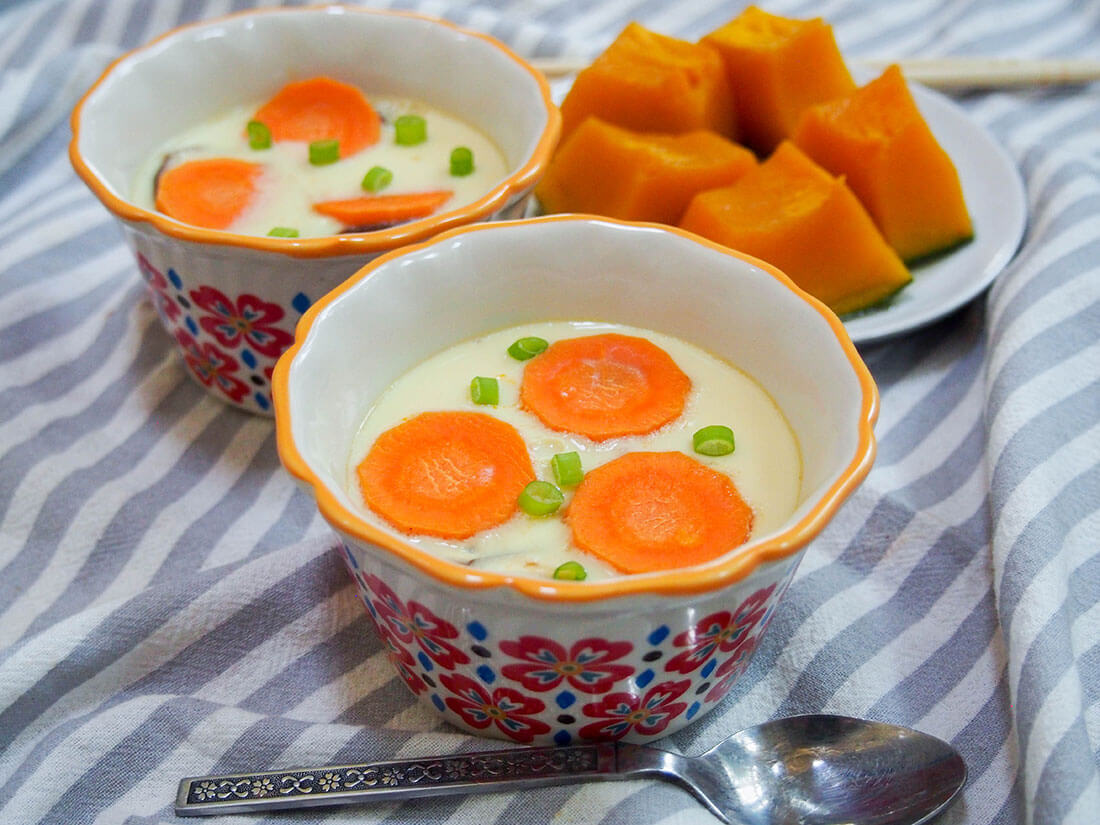 Chawanmushi is a silky-smooth savory egg custard that's a popular side with Japanese meals. It's easy to make, adaptable and so delicious. 2 dishes of Chawanmushi (Japanese savory egg custard) with some simmered kabocha squash behind