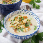 close view of Jerusalem artichoke soup topped with pangrattato toasted crumbs