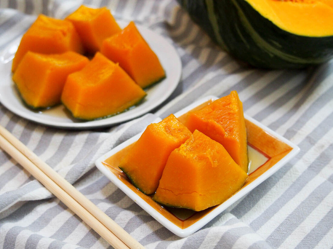 Kabocha is a bright, sweet squash and this classic Japanese way of preparing it, kabocha no nimono, really brings out the best in it. Tender, flavorful and with such a great rounded flavor. A delicious side. small and larger plates of kabocha no nimono with chopsticks to side