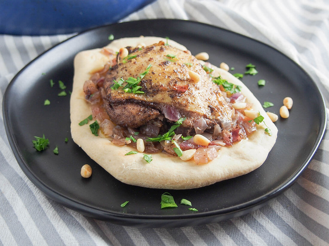 Musakhan is a classic Palestinian chicken dish, with a wonderful combination of tart sumac and gently sweet onions. This sumac chicken is easy to prepare, comforting and delicious! Musakhan (Palestinian sumac chicken) served on bread on a plate