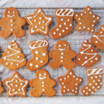 rows of pepparkakor Swedish ginger thins with icing decorations.