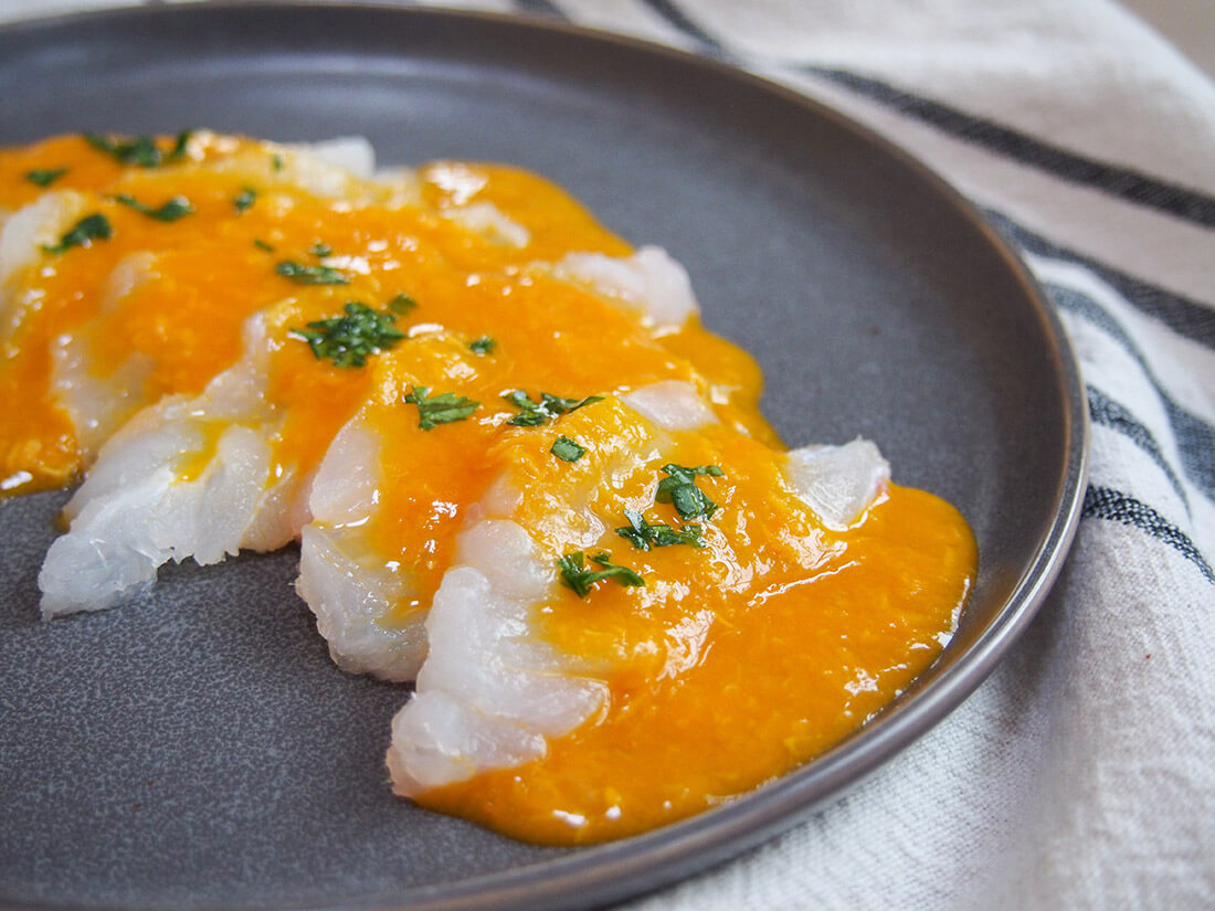 Tiradito is a Peruvian take on sashimi, with a spicy citrus sauce. It's easy to prepare, light and with a wonderful chili kick! Tiradito - Peruvian sashimi with chili sauce