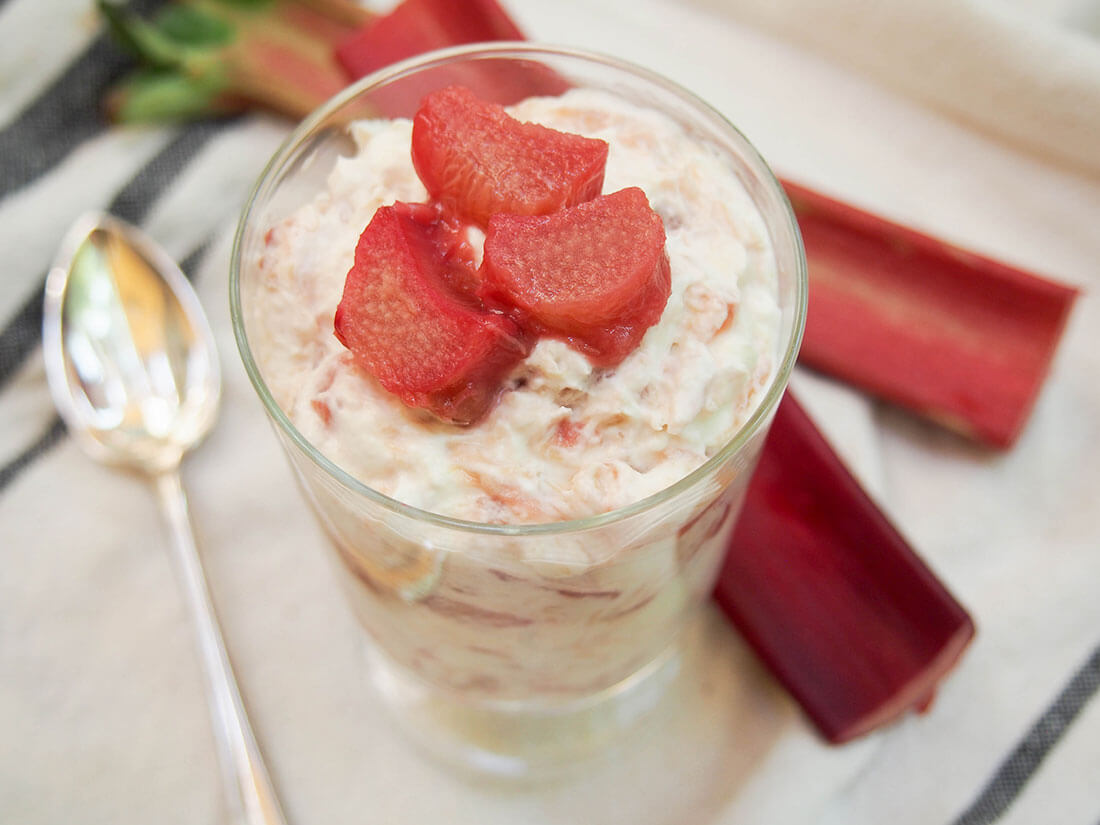 Rhubarb fool is a classic British dessert that's an easy delight you need to try. Light, creamy, tart and flavorful, it shows rhubarb off at it's finest. Rhubarb fool with rhubarb behind