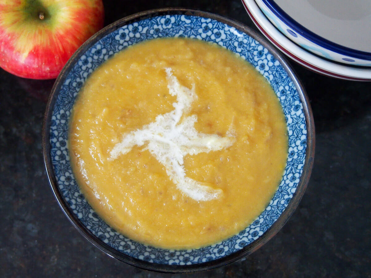 Roasted apple and acorn squash soup is so easy to make, smooth and comforting. It's a perfect bowl of fall goodness. roasted apple and acorn squash soup
