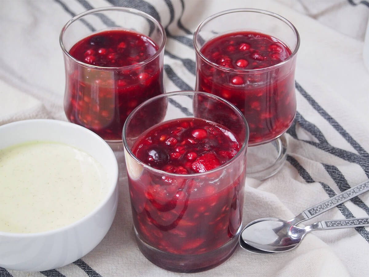 Rote Grütze (Rote Gruetze) Three glasses of Rote Grütze (Rote Gruetze) with a bowl of vanilla sauce to the side