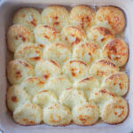 dish of semolina gnocchi, gnocchi alla Romana, from overhead.