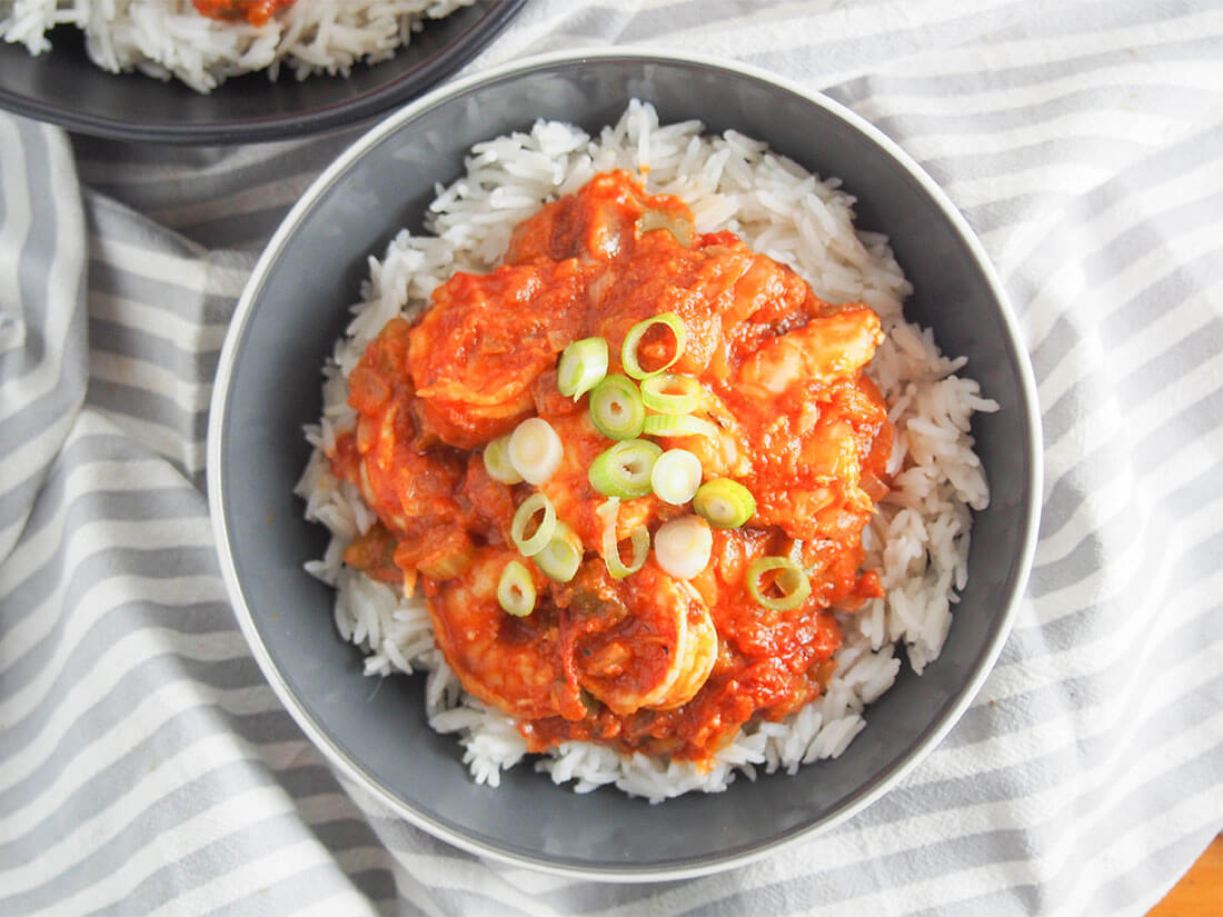Shrimp Creole is a classic Louisiana dish that's quick & easy to make, and packed with flavor. Spice it up or down, these are flavors you're sure to love. Bowl of shrimp creole viewed from overhead