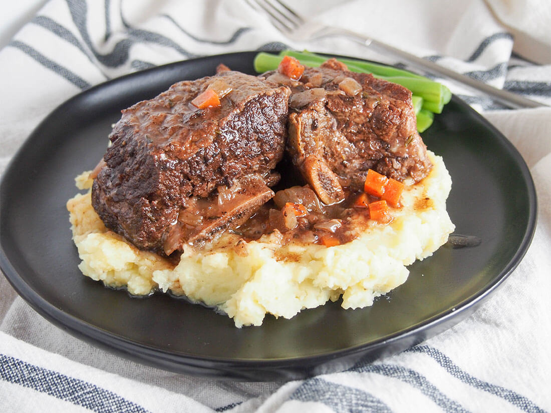 These slow cooker short ribs are easy to prepare, fall-off-the-bone tender and packed with flavor after testing for the perfect set of ingredients. So good. slow cooker short ribs served over mashed potato on plate