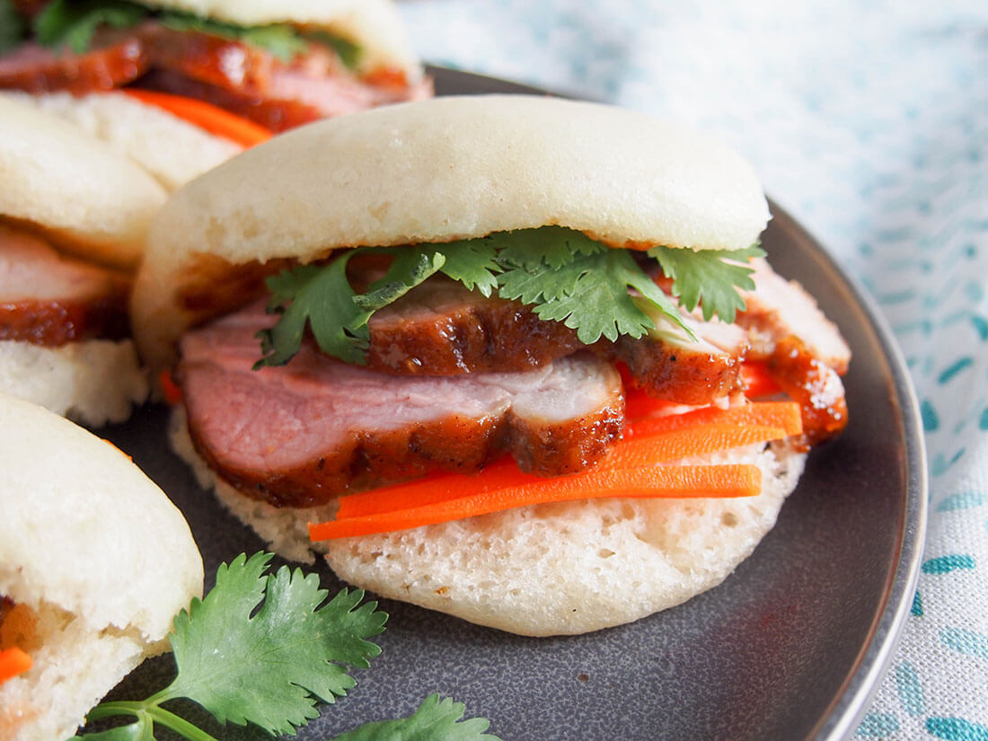 steamed bao buns with pork close up of bun steamed bao buns with pork close up of bun showing fillings
