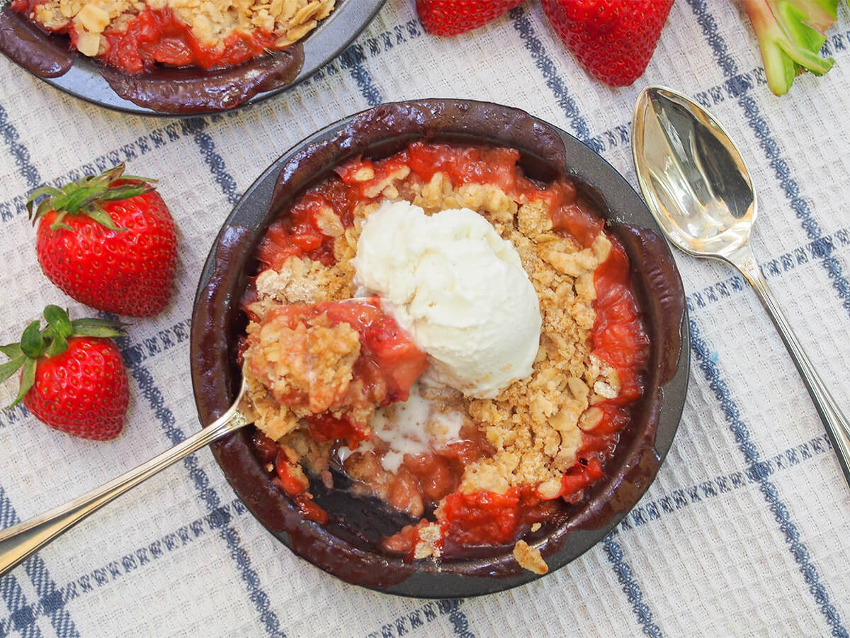 strawberry rhubarb crisp strawberry rhubarb crisp with spoon in dish and spoon to side