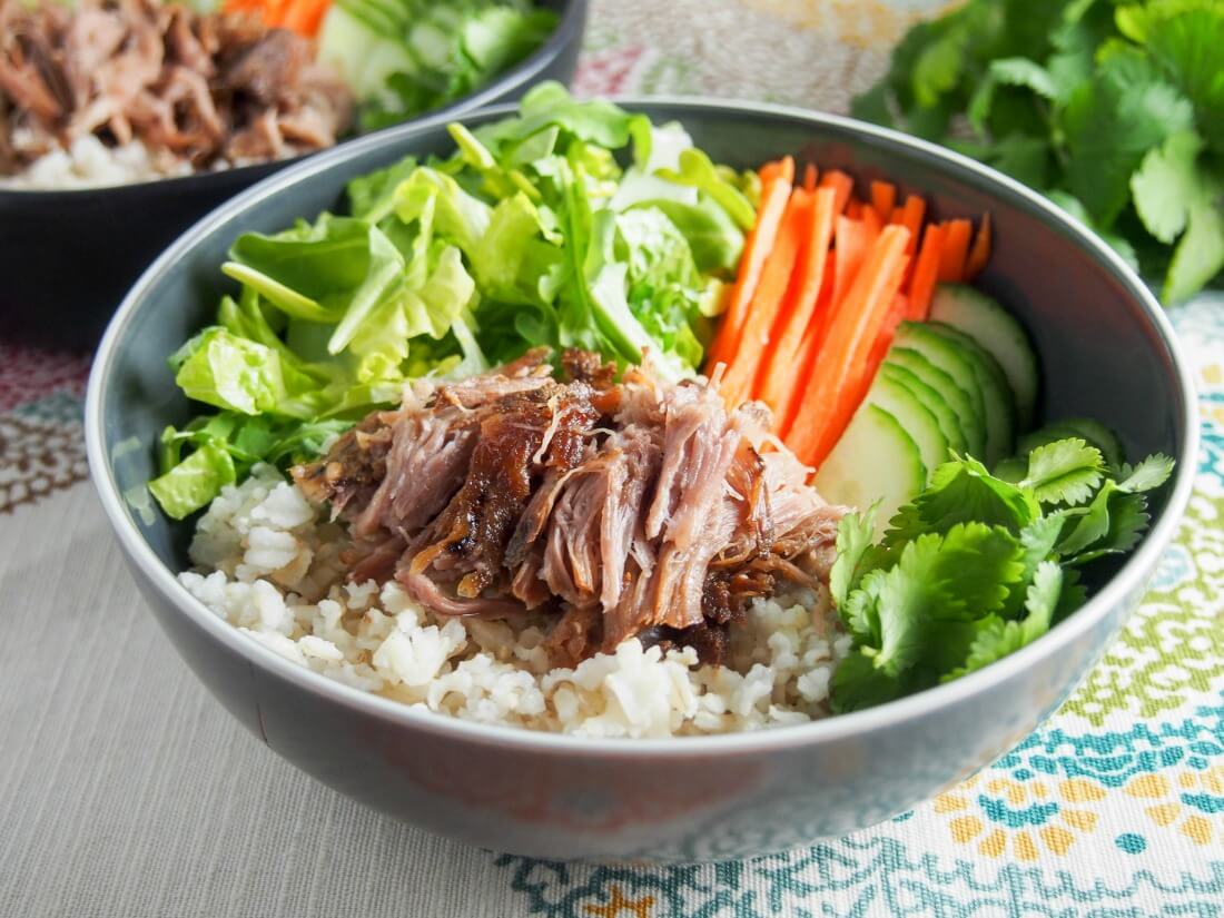 Easy to prepare in the slow cooker, this Vietnamese banh mi pork is tender, flavorful, and perfect for meal prep with lots of tasty possibilities! Vietnamese banh mi pork served as rice bowl